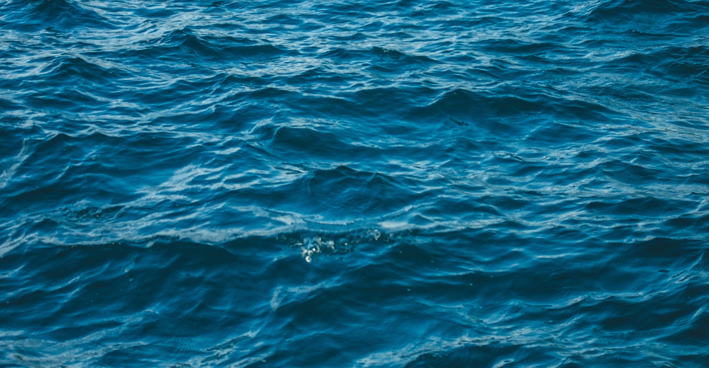 Cruise ship sailing at sunset